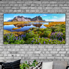 Tablou canvas peisaj colorat montan langa lac cu pajiste cu flori mov